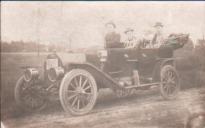 3_unidentifed_men_in_old_car